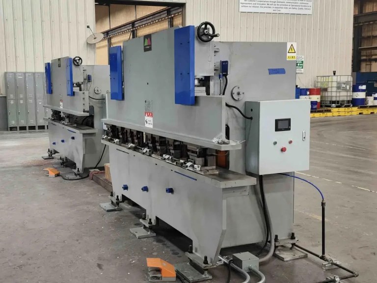 The offline holes punching station, featuring hydraulic or mechanical presses equipped with multiple dies to create precise mounting holes and slots in the roll-formed solar panel frame profiles.