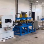 Close-up of servo feeder and hydraulic punching device on sigma purlin roll forming machine.
