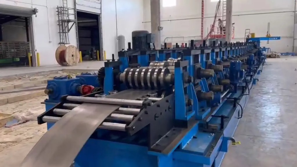 Industrial roll forming mill stands for sigma purlin production on a heavy-duty machine.