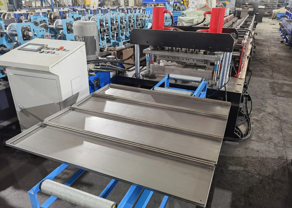 "Beli’s shelf panel roll forming machine mid-operation: The modular roll former (16–24 GCr15 steel rollers) shaping flat steel into ribbed shelving panels—adding strength for heavy retail loads