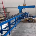 Automated stacker collecting finished sigma purlins from a roll forming machine.