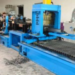 Flying hydraulic cutter in action on a sigma purlin roll forming machine, making a clean cut.