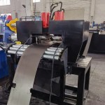 Close-up of the integrated CNC Shelf Panel Roll Forming Machine Puncher and Notcher station.