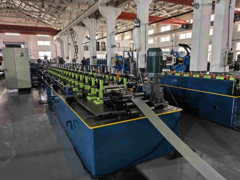 Precision Feeder and Guider system aligning the steel strip into the C Stud Roll Forming Machine for optimal alignment and minimal material waste.